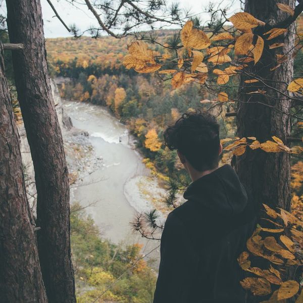 Person looking serene and balanced in a bright, open space.